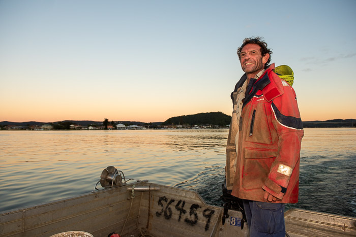 Pearl farmer at dawn, Brisbane Water, NSW